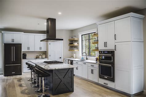 white cabinet and black stainles steel appliances|black fridge in white kitchen.